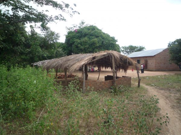 a grass thatched structure where children of Lorna Nursery and primary school were studying before the church gave them a small space.